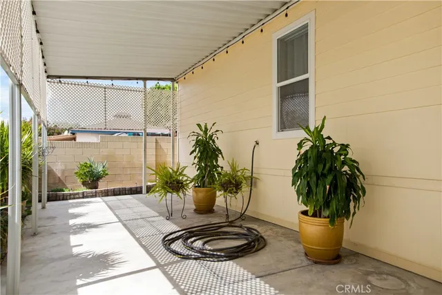 a view of a porch with wooden stairs