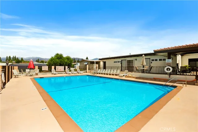 a kitchen with a stove a refrigerator and a sink