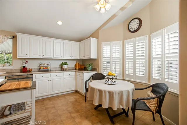 a kitchen with a dining table and chairs