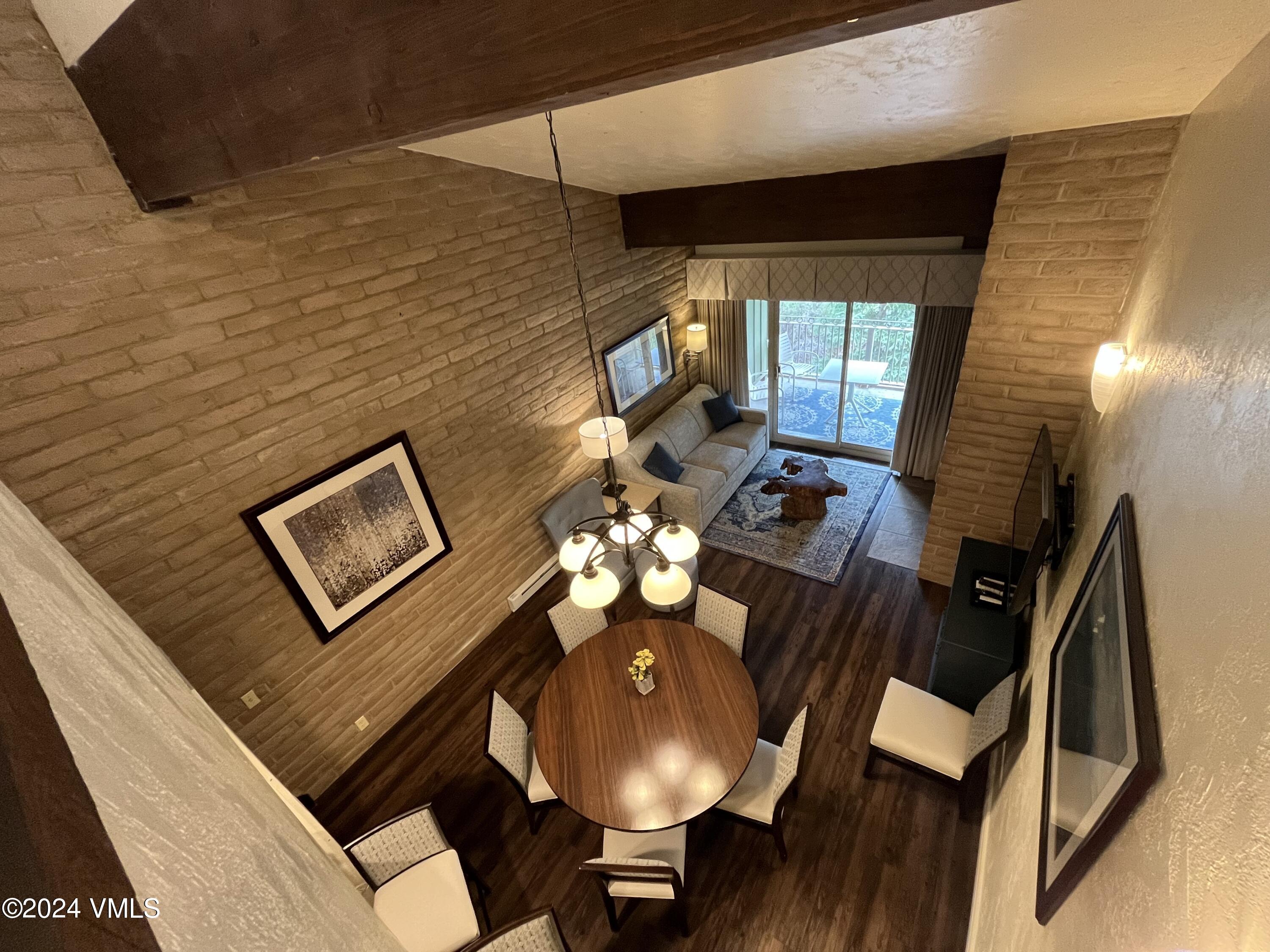 1020 Vail View Drive, Unit 341227 Vail, CO 81657 - Photo 11 of 26 a view of a livingroom with furniture and a table