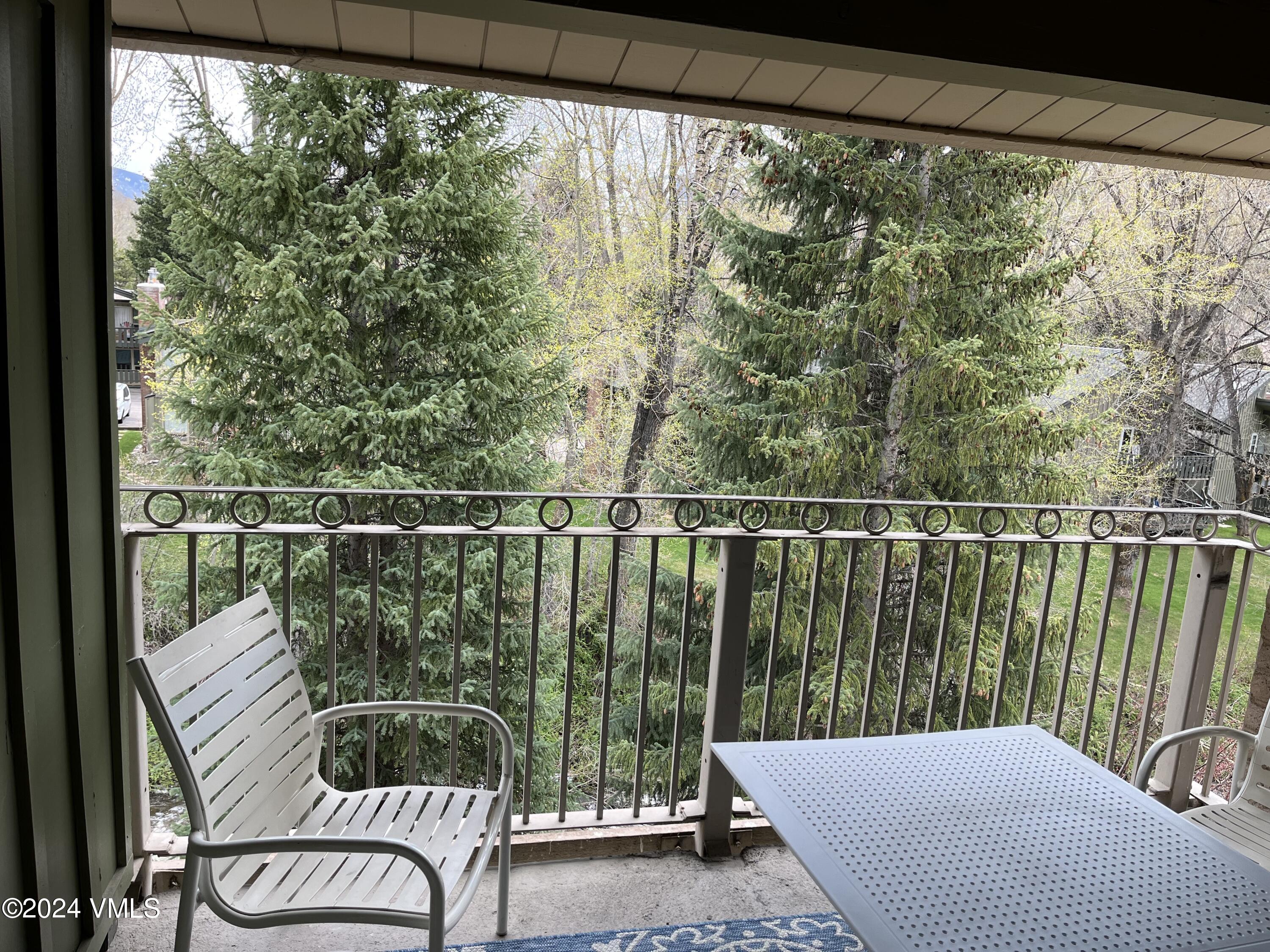 1020 Vail View Drive, Unit 341227 Vail, CO 81657 - Photo 4 of 26 a view of a balcony with wooden floor