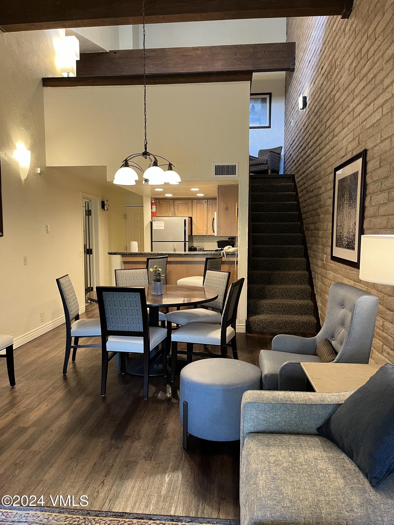 1020 Vail View Drive, Unit 341227 Vail, CO 81657 - Photo 5 of 26 a living room with furniture and a wooden floor