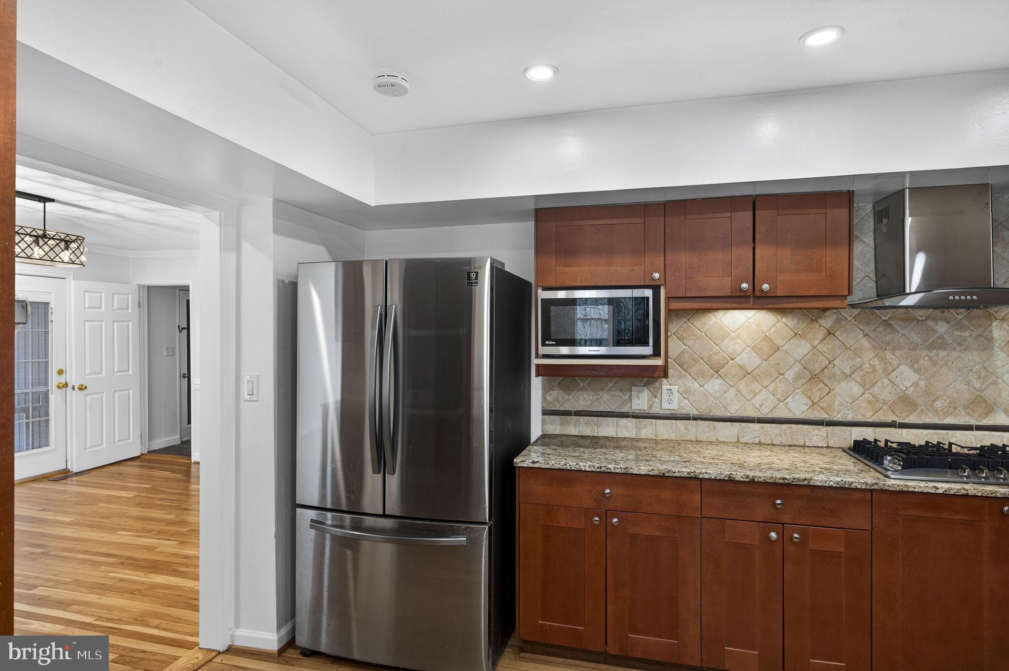 10600 Vantage Court Potomac, MD 20854 - Photo 19 of 91 a kitchen with stainless steel appliances granite countertop a refrigerator and a sink