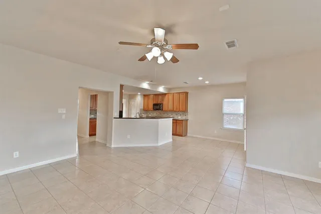 a view of a kitchen with a sink and a window