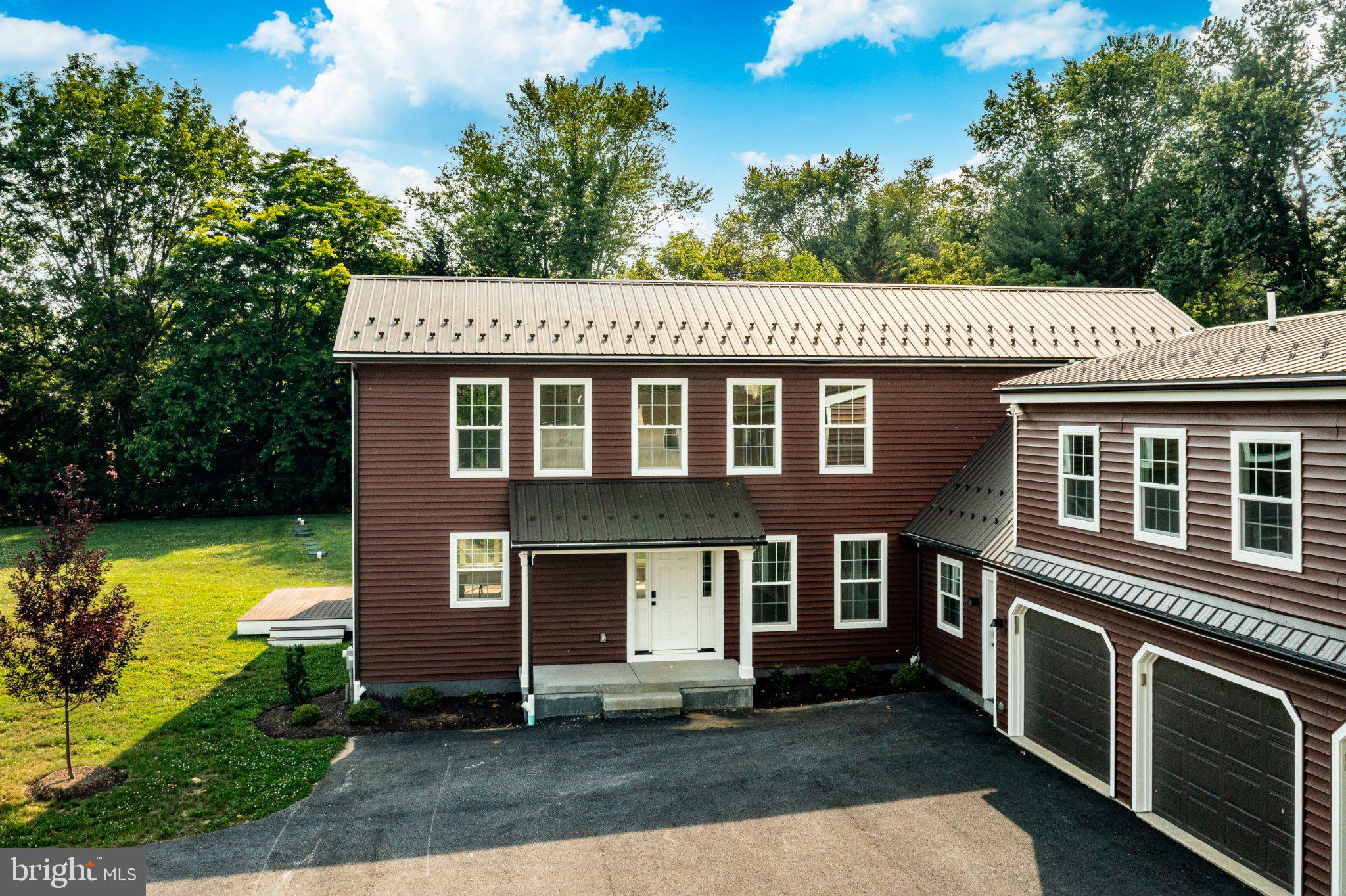 2069 Dutton Mill Road Newtown Square, PA 19073 - Photo 68 of 70 Charming home with lush greenery backdrop.