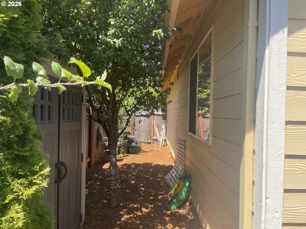 a backyard of a house with lots of trees