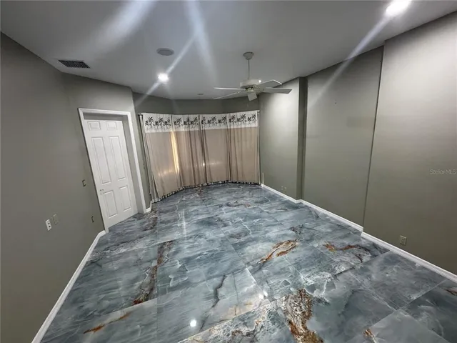a bathroom with a sink and shower