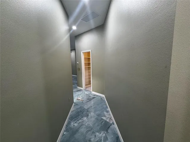 a bathroom with a granite countertop toilet a sink and shower