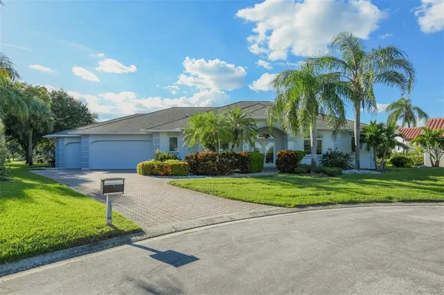 a front view of house with yard and outdoor seating