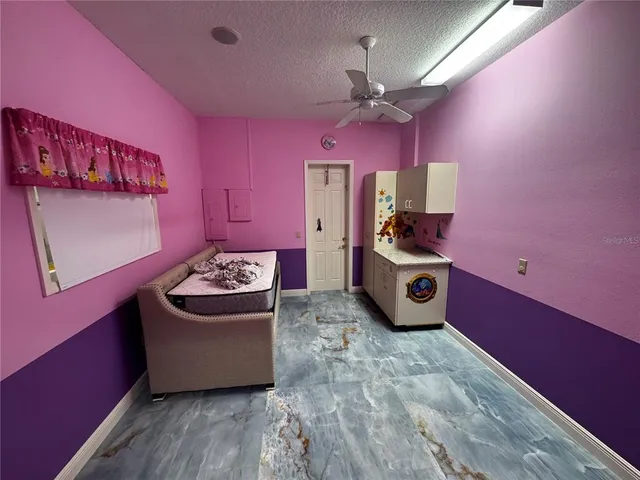a bathroom with a granite countertop sink a vanity and shower
