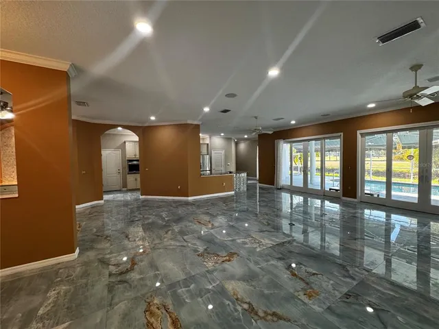 a view of kitchen with sink and windows