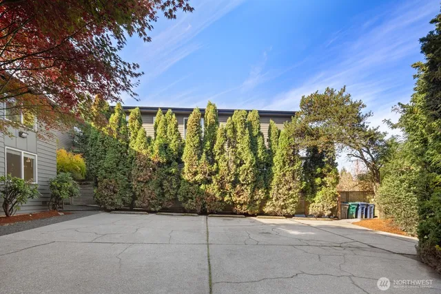 a kitchen with stainless steel appliances granite countertop a refrigerator sink and stove
