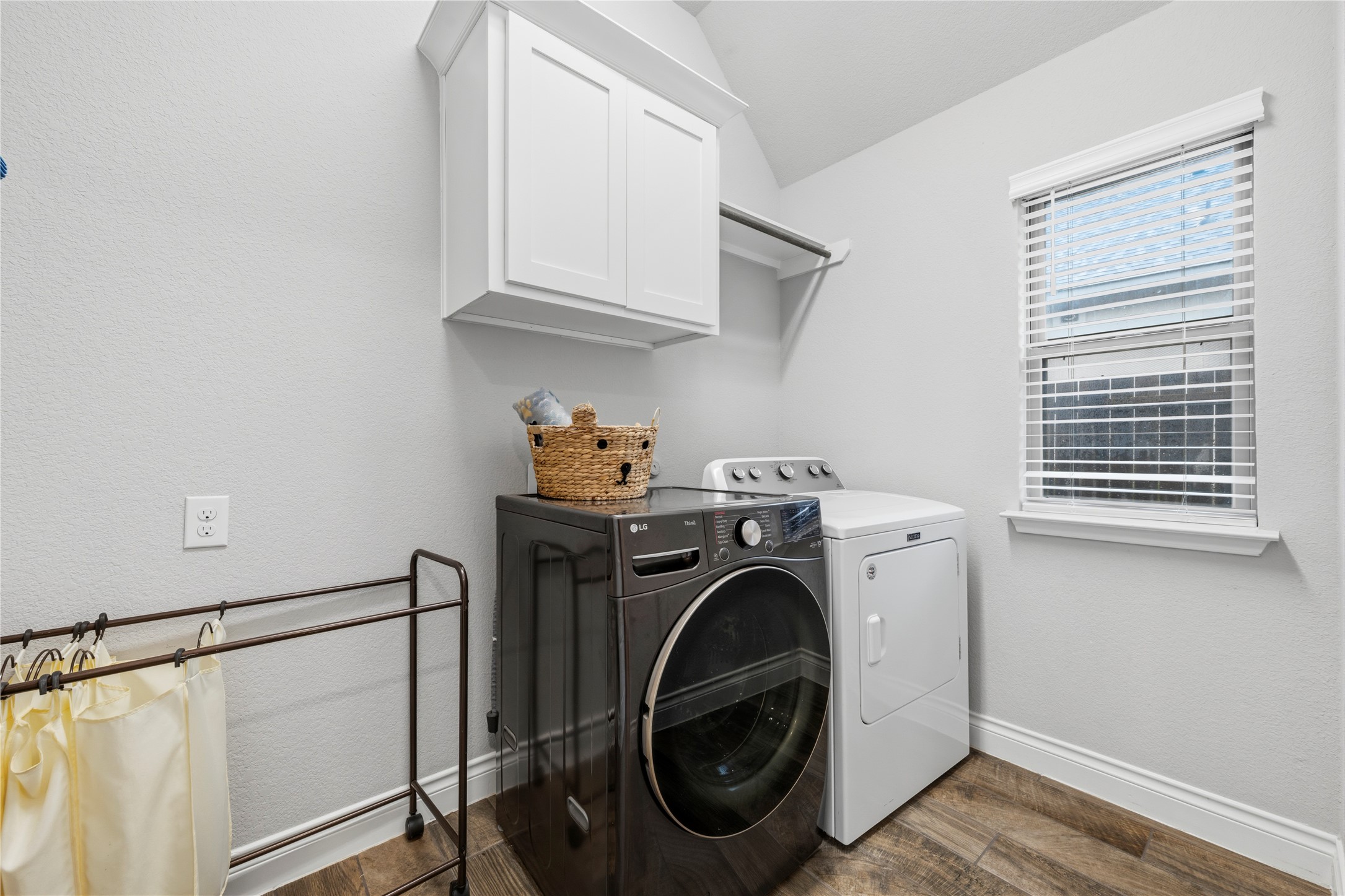 140 Catani Loop Georgetown, TX 78628 - Photo 22 of 36 Functional utility room with ample storage and space for laundry appliances.