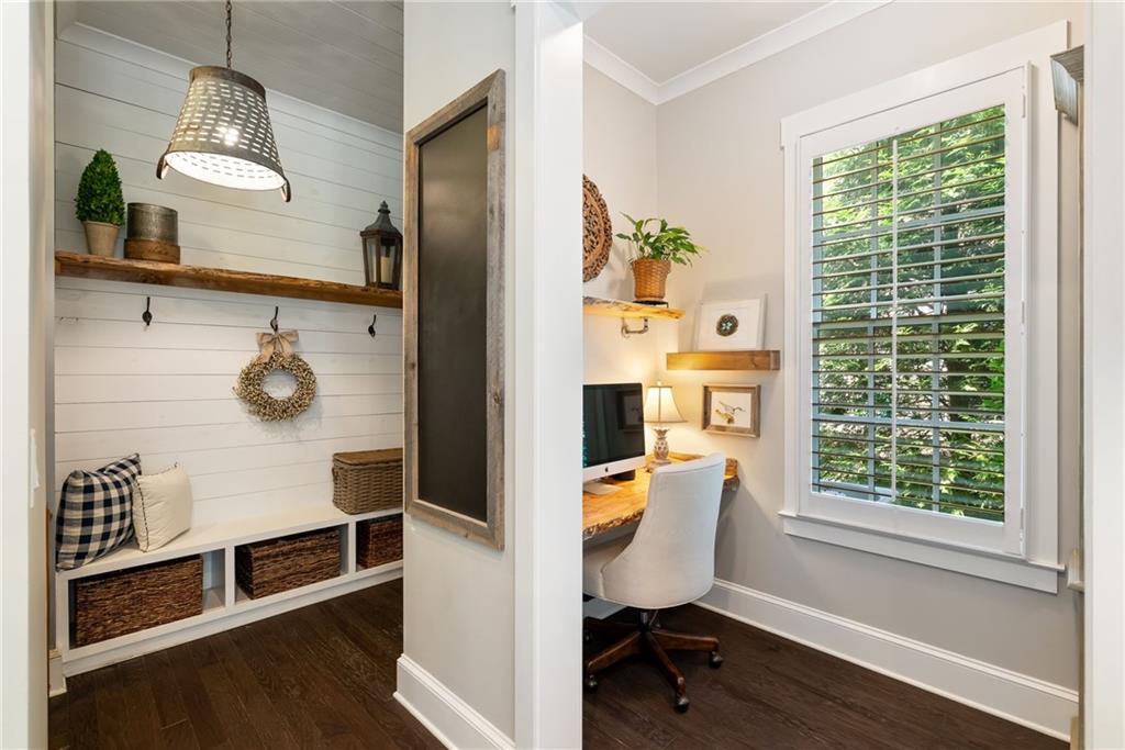 7240 Samples Field Road Cumming, GA 30040 - Photo 25 of 84 a view of a workspace with furniture and a window