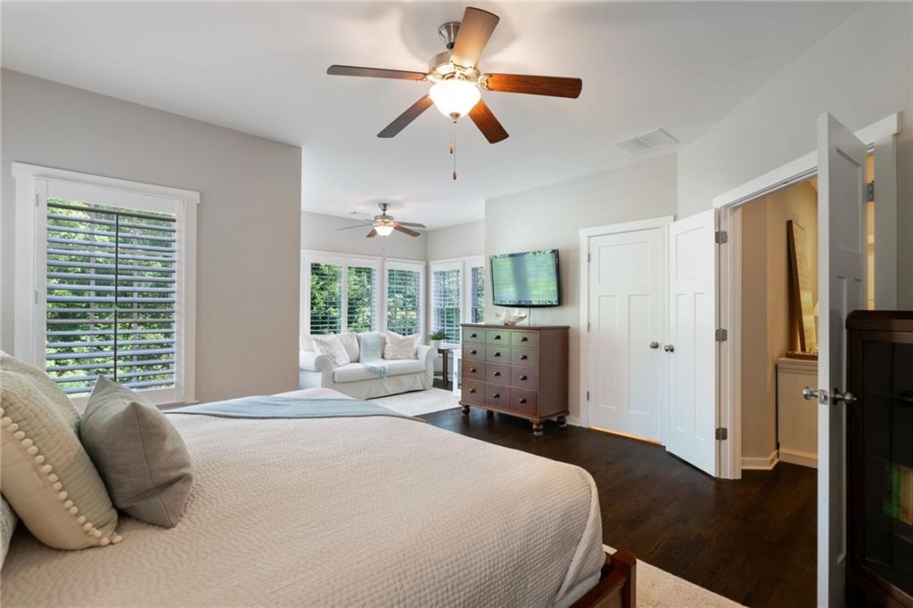 7240 Samples Field Road Cumming, GA 30040 - Photo 34 of 84 a bedroom with a bed dresser and a large window