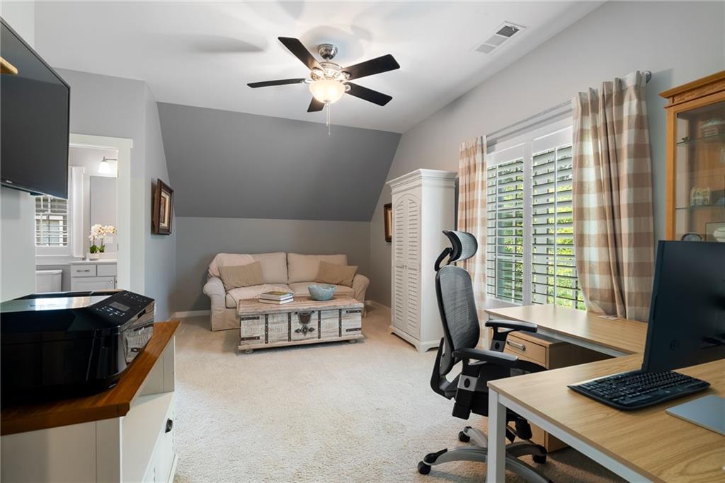 7240 Samples Field Road Cumming, GA 30040 - Photo 38 of 84 a view of a workspace with furniture and a window
