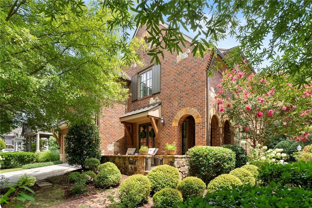 7240 Samples Field Road Cumming, GA 30040 - Photo 4 of 84 a front view of a house with garden