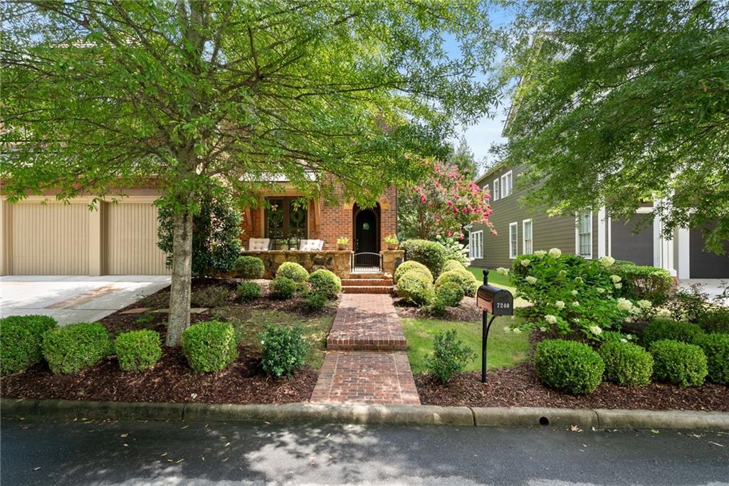 7240 Samples Field Road Cumming, GA 30040 - Photo 45 of 84 a front view of a house with garden
