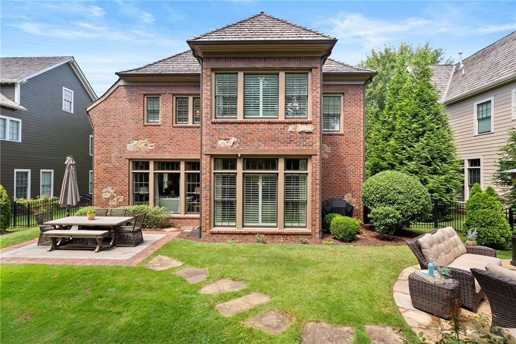 7240 Samples Field Road Cumming, GA 30040 - Photo 47 of 84 a front view of a house with garden