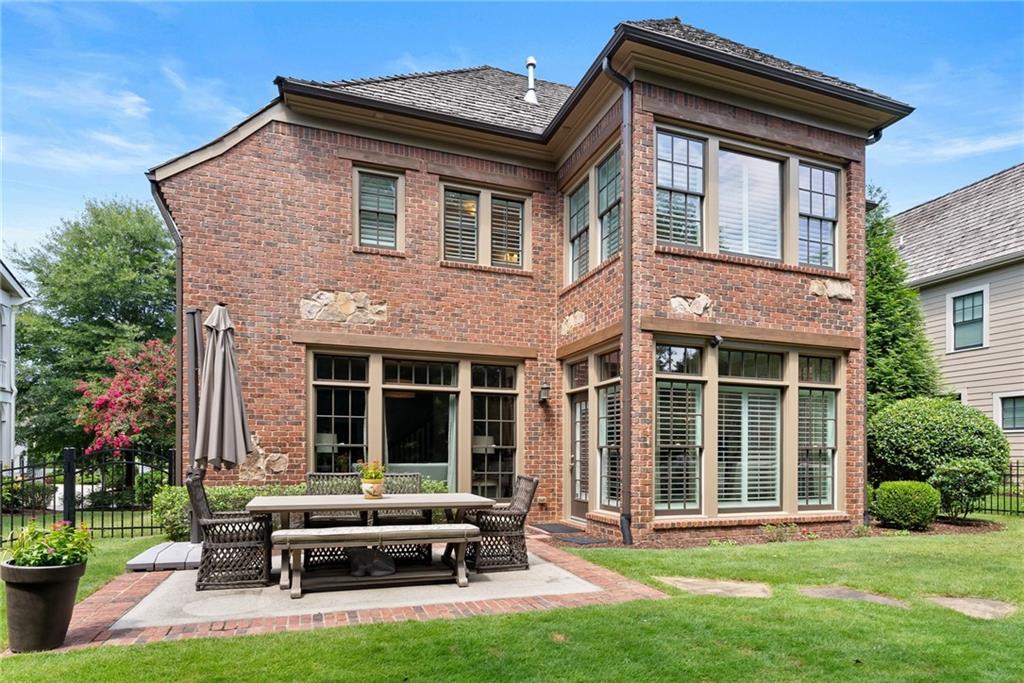 7240 Samples Field Road Cumming, GA 30040 - Photo 48 of 84 a backyard of a house with yard and outdoor seating