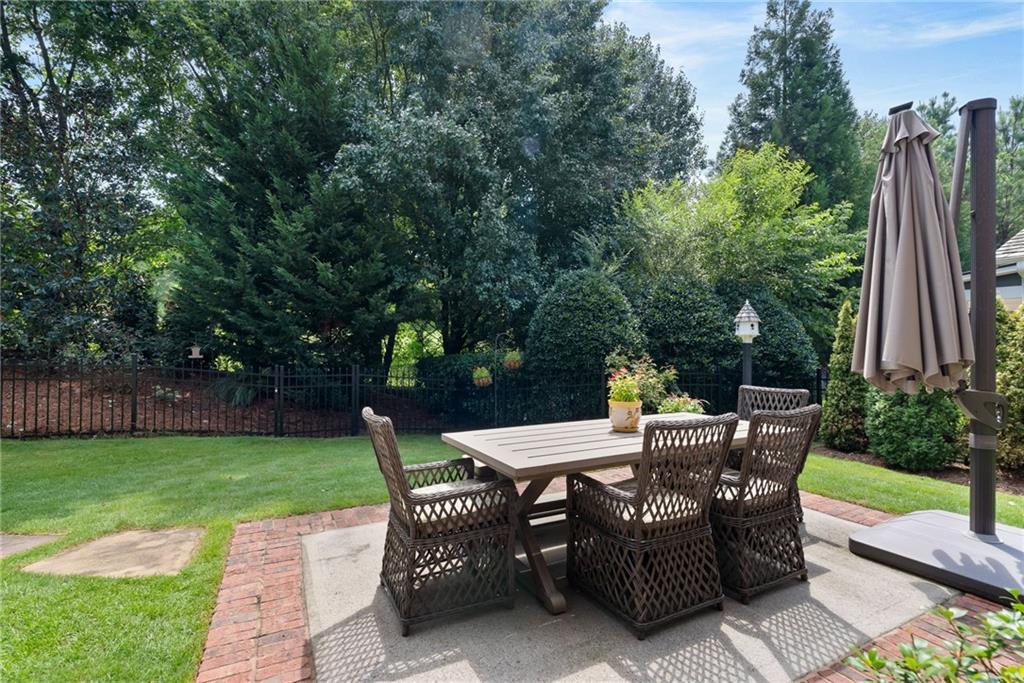 7240 Samples Field Road Cumming, GA 30040 - Photo 49 of 84 a view of a sitting area with furniture in backyard