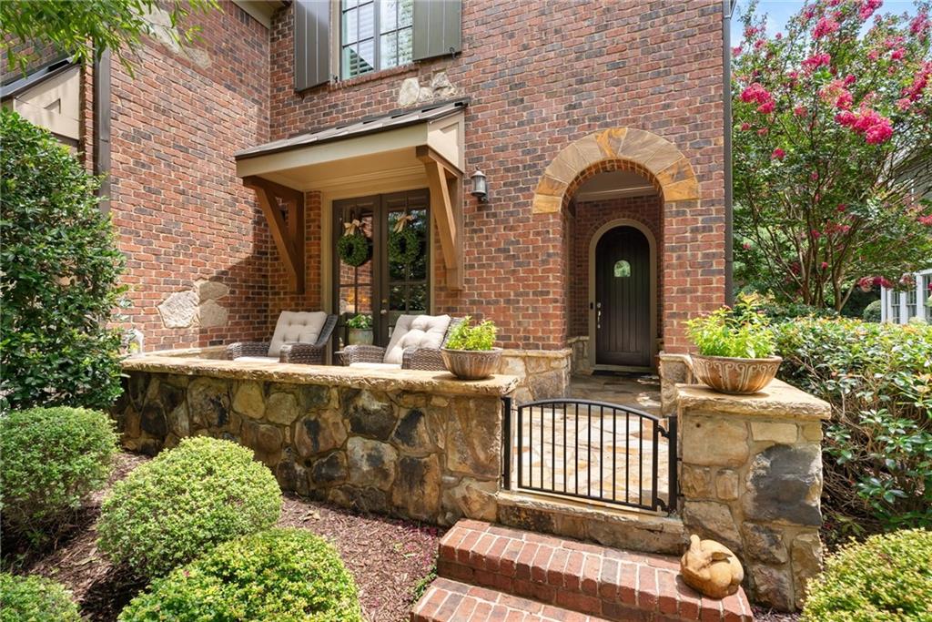 7240 Samples Field Road Cumming, GA 30040 - Photo 5 of 84 a front view of a house with a garden