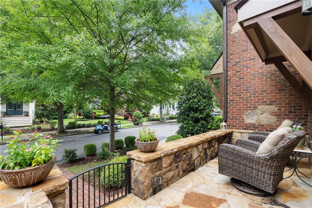 7240 Samples Field Road Cumming, GA 30040 - Photo 6 of 84 a view of a patio with couches table and chairs and potted plants