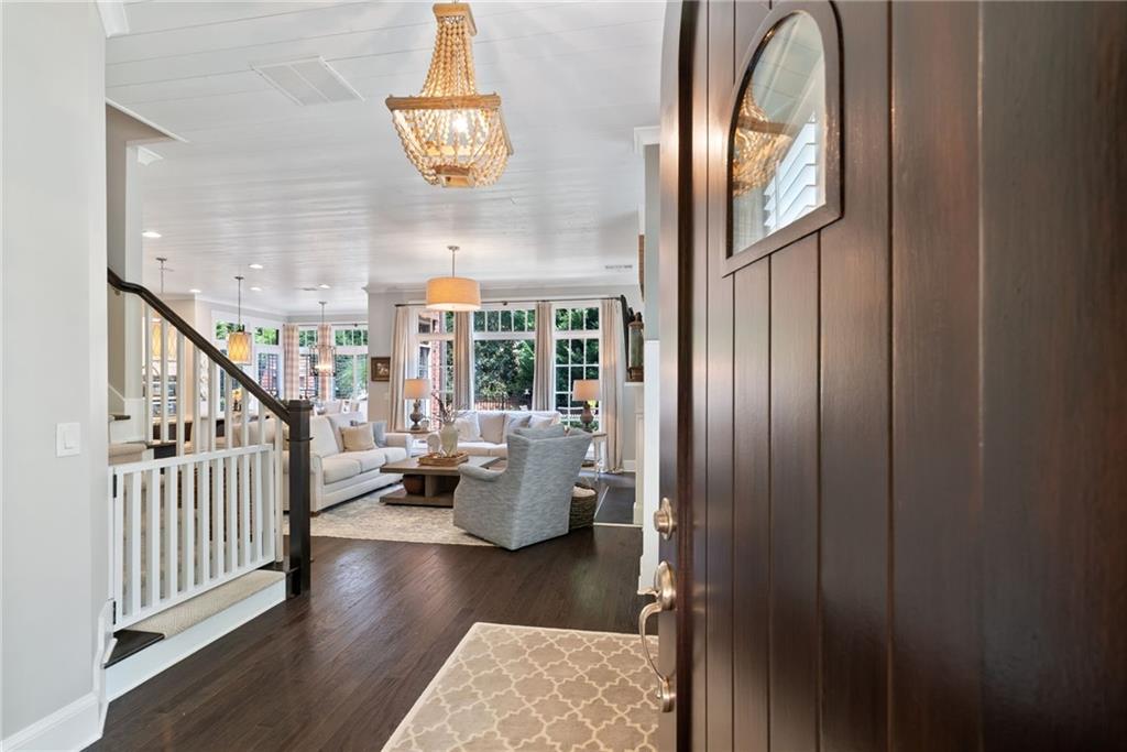 7240 Samples Field Road Cumming, GA 30040 - Photo 8 of 84 a view of entryway and hall with wooden floor