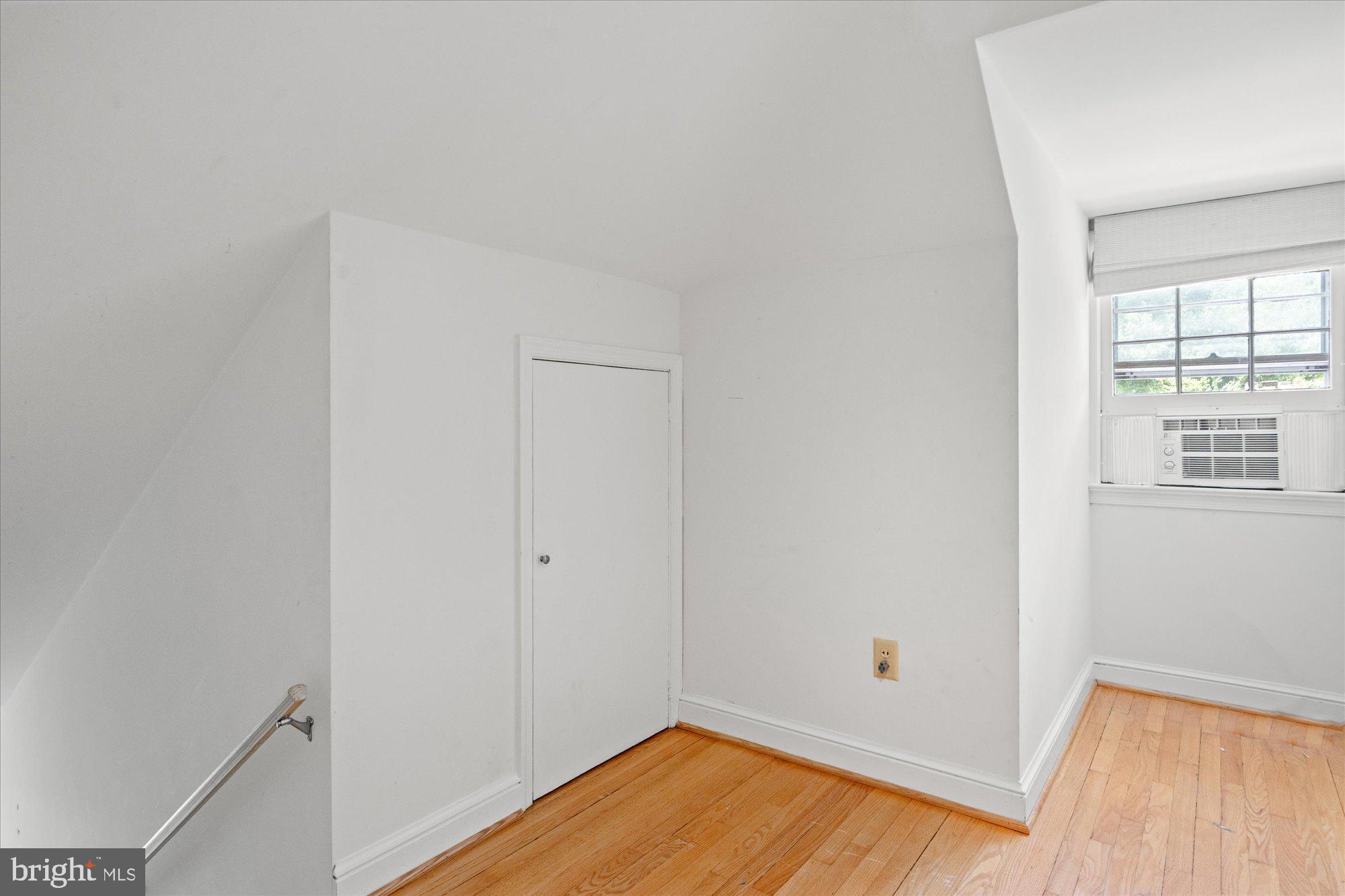 8300 Kerry Road Chevy Chase, MD 20815 - Photo 29 of 42 a view of room with window and wooden floor