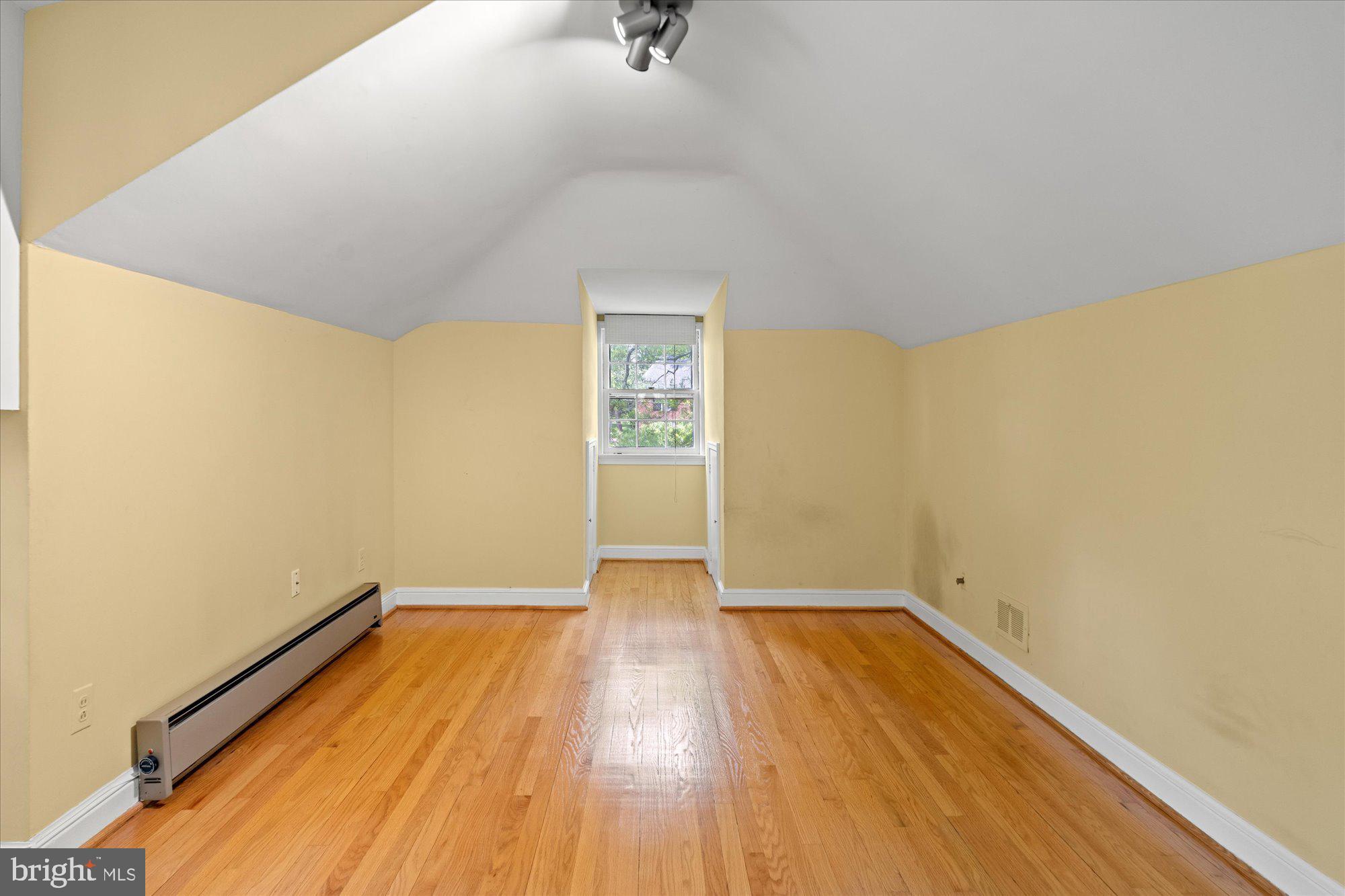 8300 Kerry Road Chevy Chase, MD 20815 - Photo 30 of 42 a view of a room with wooden floor and white walls