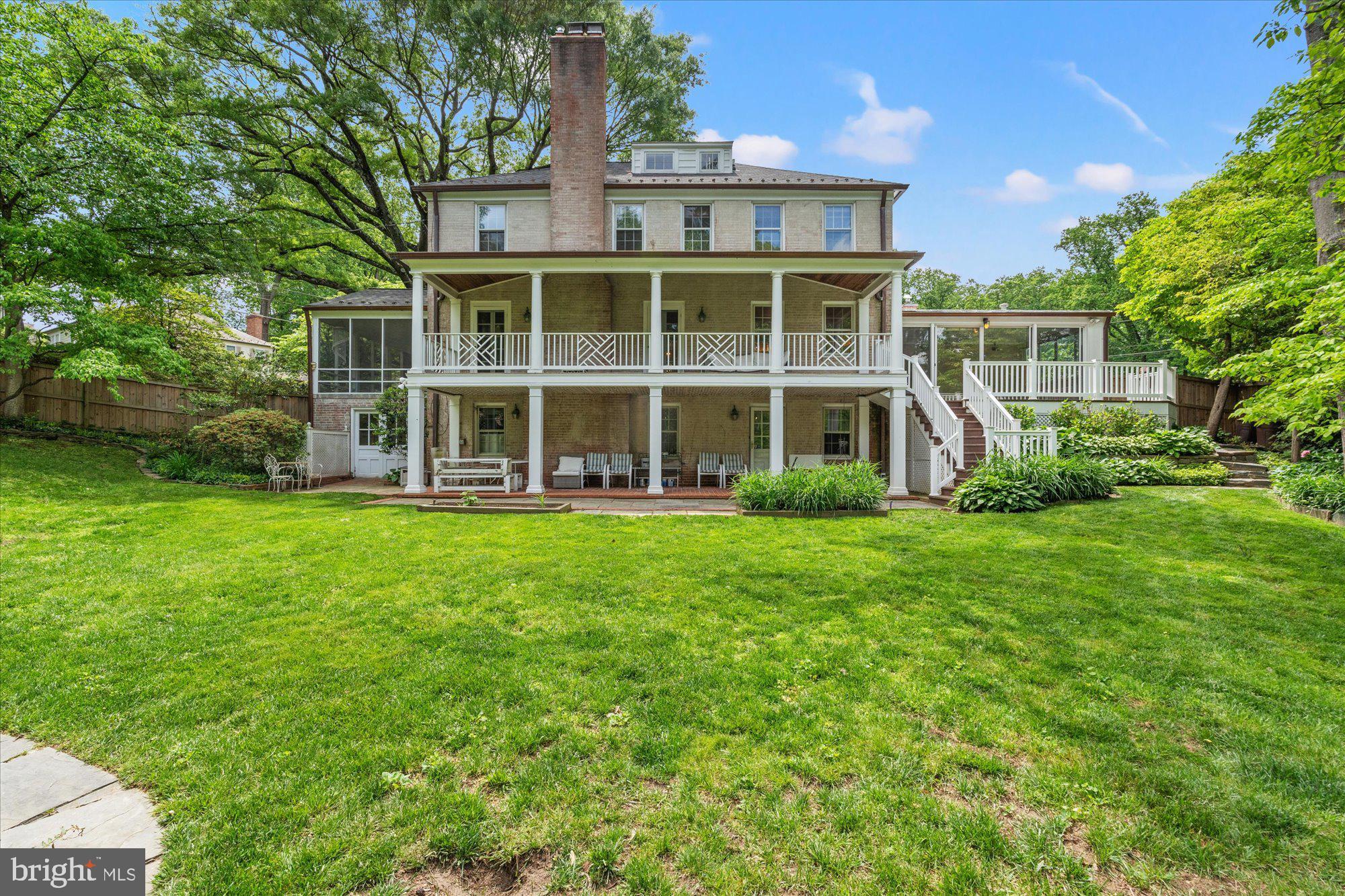 8300 Kerry Road Chevy Chase, MD 20815 - Photo 3 of 42 a front view of a house with a yard