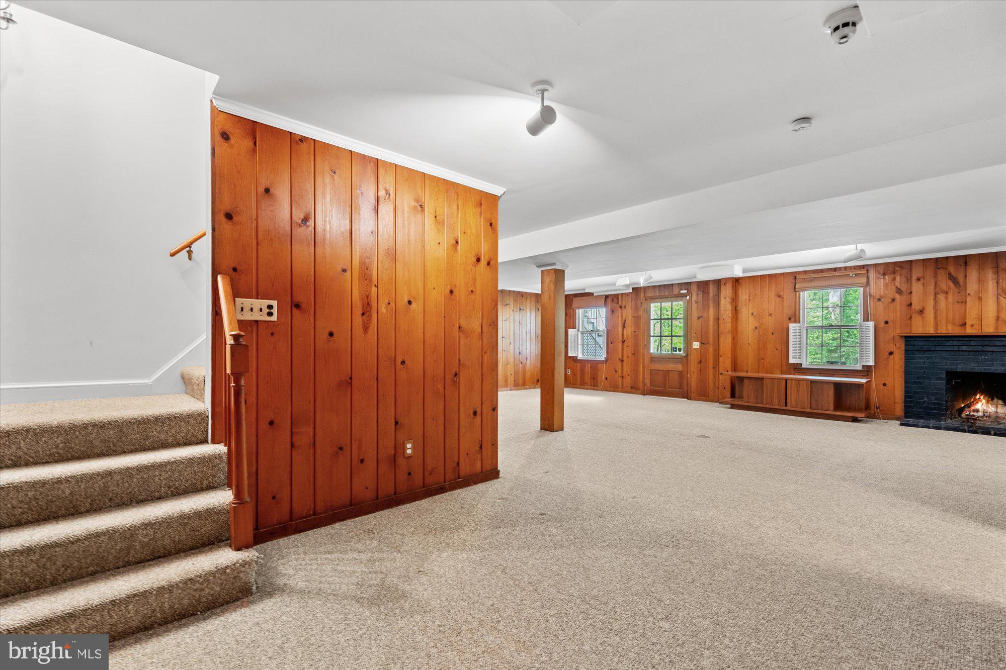 8300 Kerry Road Chevy Chase, MD 20815 - Photo 32 of 42 a view of an empty room with a fireplace and a window
