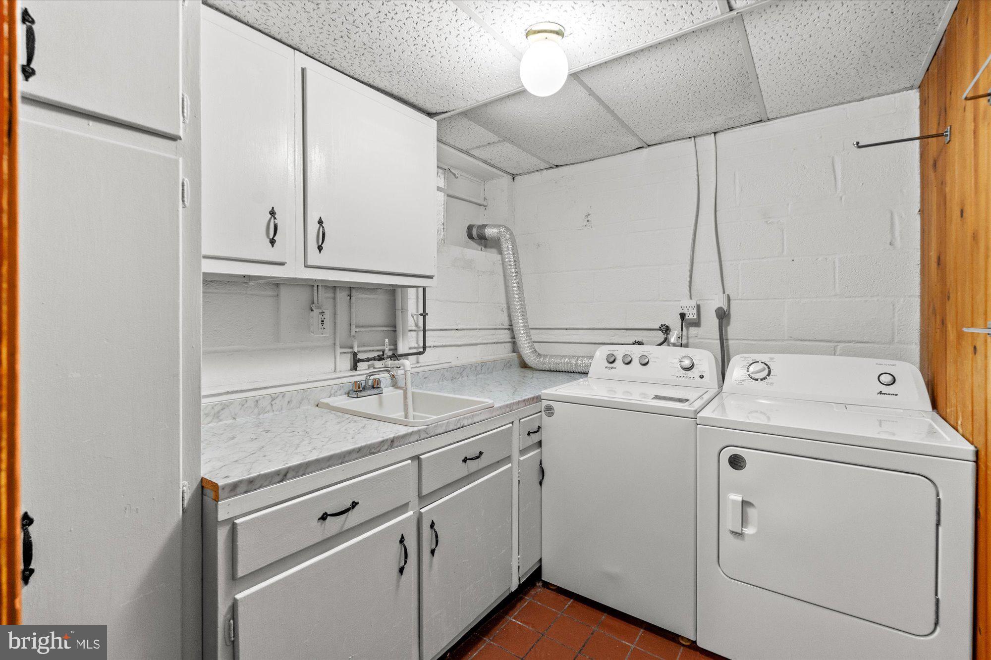 8300 Kerry Road Chevy Chase, MD 20815 - Photo 35 of 42 a view of washer and dryer with bathroom in the background