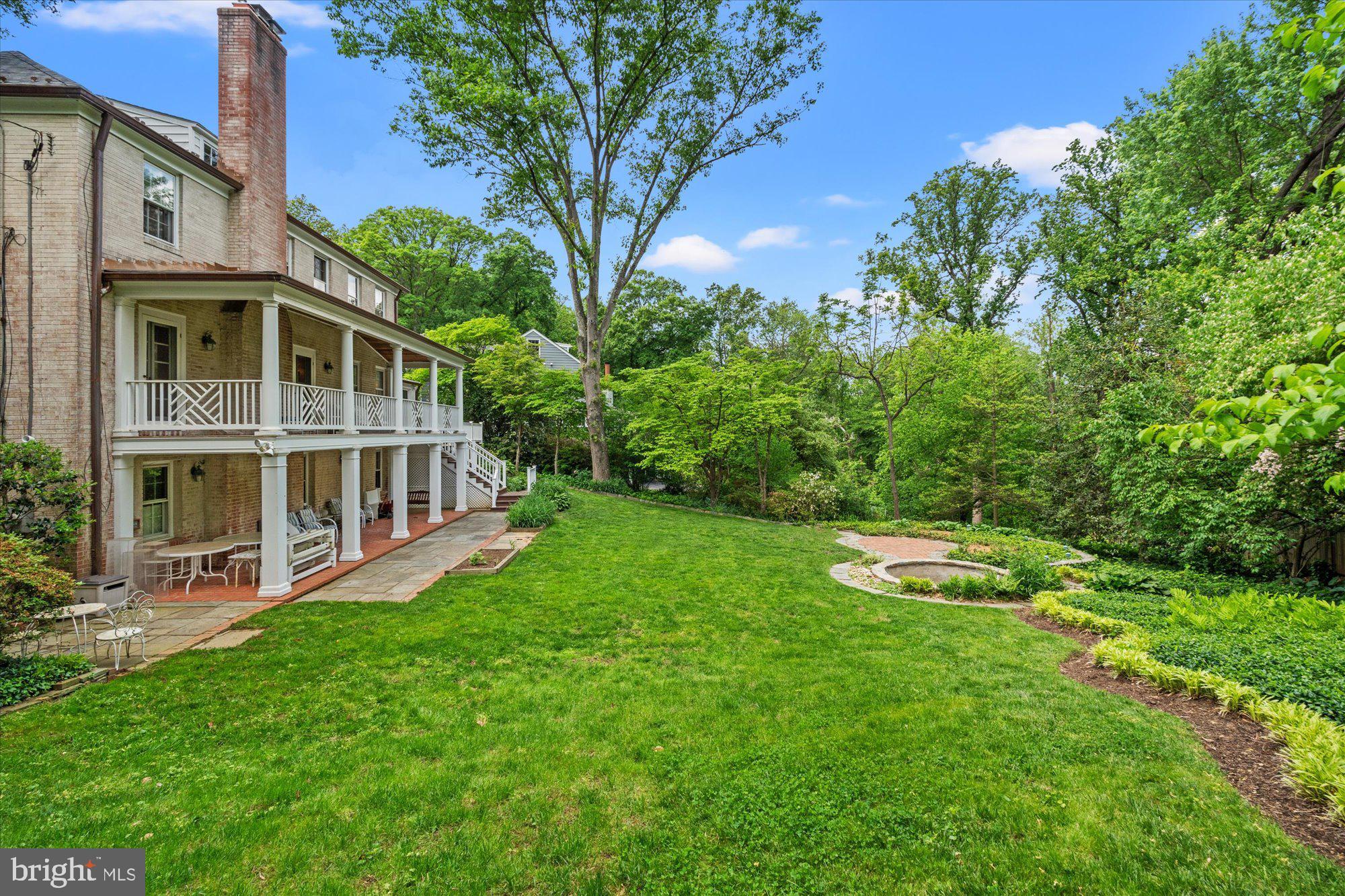 8300 Kerry Road Chevy Chase, MD 20815 - Photo 38 of 42 a view of a house with a big yard and large trees