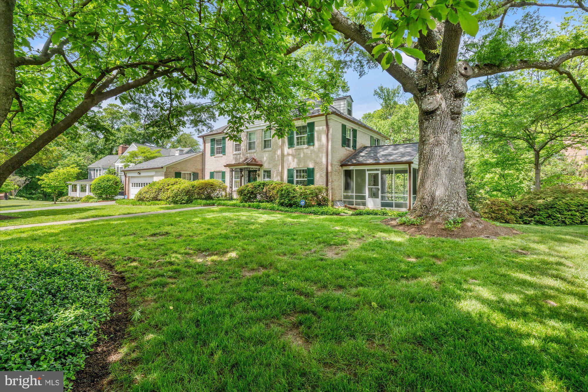8300 Kerry Road Chevy Chase, MD 20815 - Photo 40 of 42 a front view of a house with a garden