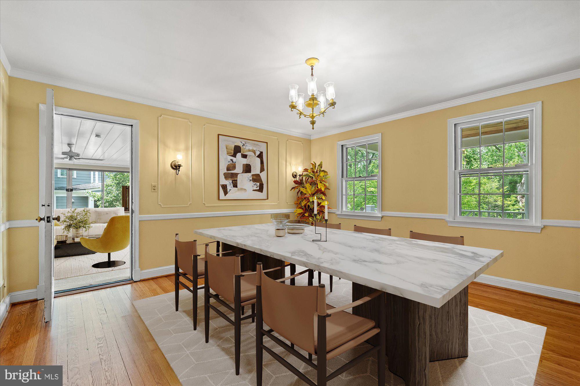 8300 Kerry Road Chevy Chase, MD 20815 - Photo 7 of 42 a view of a dining room with furniture window and wooden floor