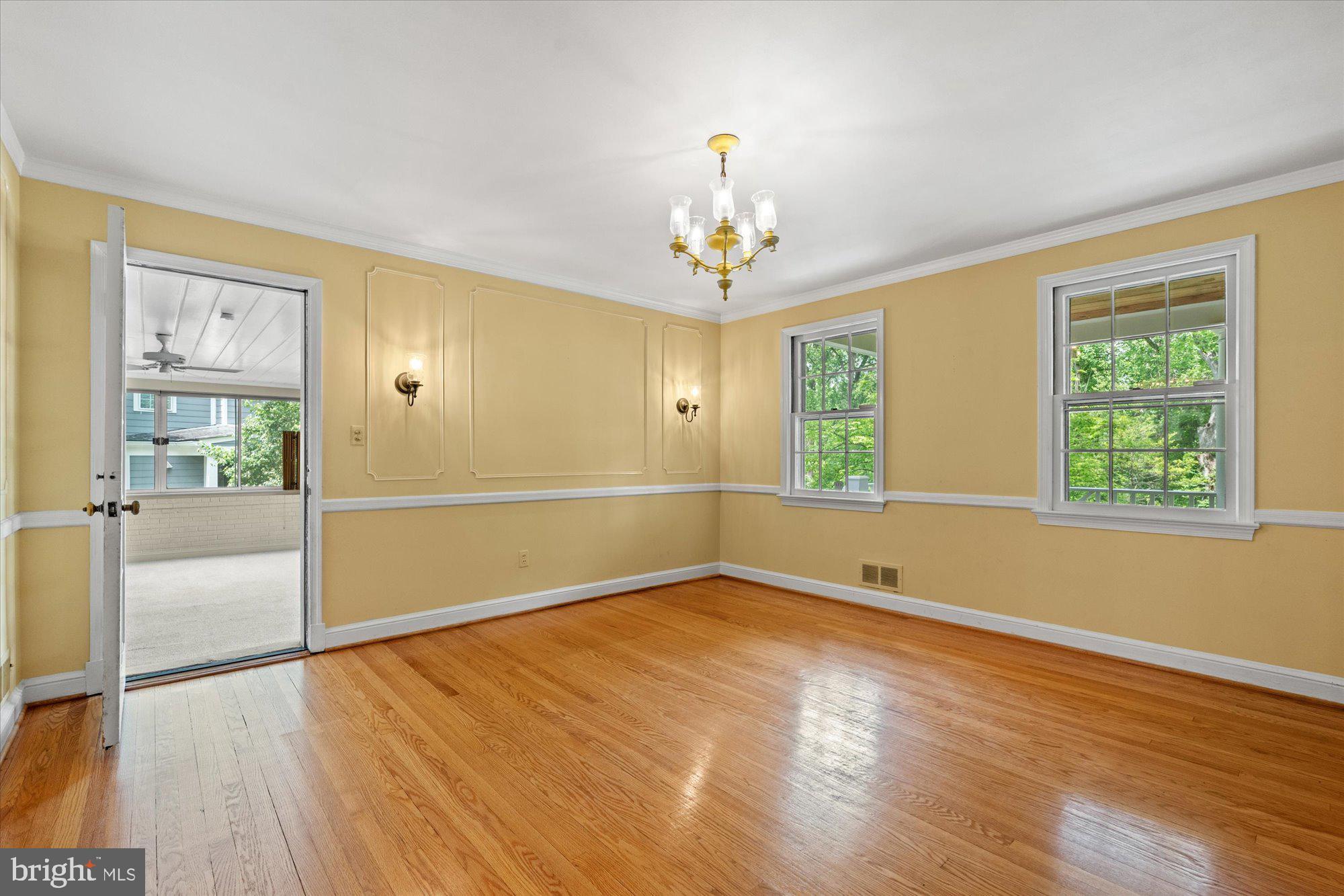 8300 Kerry Road Chevy Chase, MD 20815 - Photo 8 of 42 wooden floor in an empty room with a window