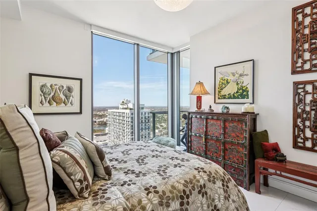 a spacious bathroom with a shower sink and mirror