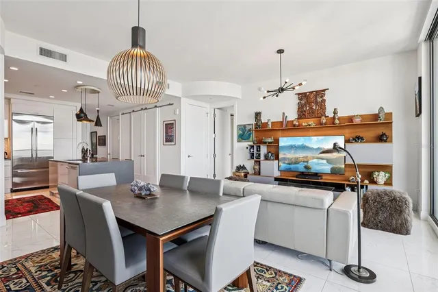 a very nice looking living room with a large window and furniture