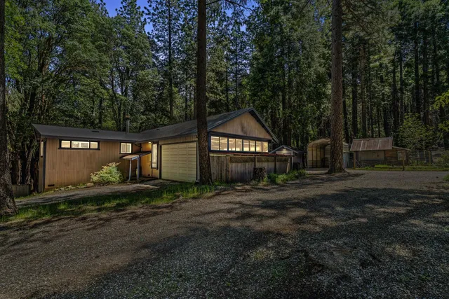 a backyard of a house with wooden fence