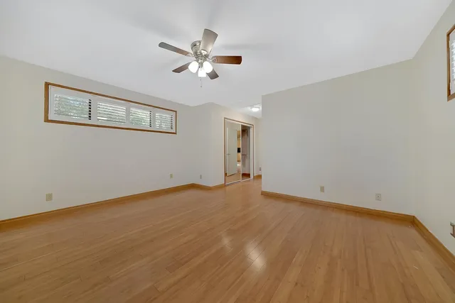 a view of a livingroom with furniture and a window
