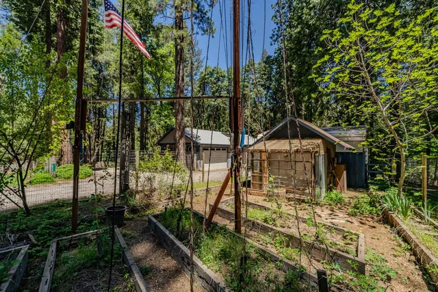a view of backyard with deck and seating area