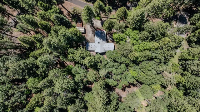 a view of balcony with wooden floor and outdoor seating