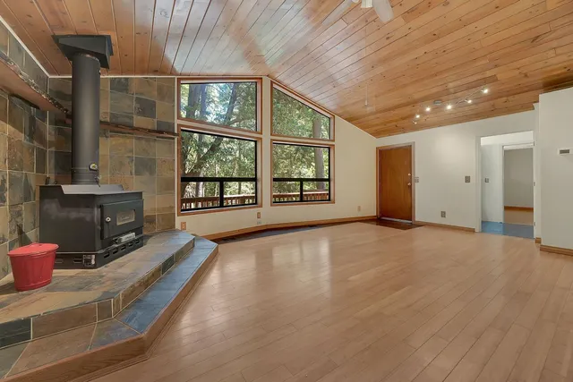 a kitchen with stainless steel appliances granite countertop a stove sink and cabinets