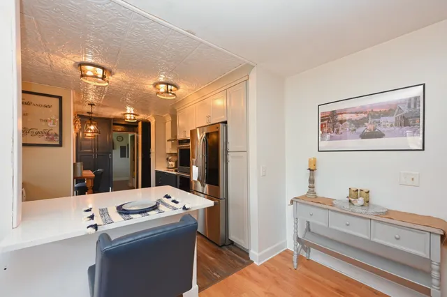 a kitchen with stainless steel appliances a stove a microwave and a refrigerator