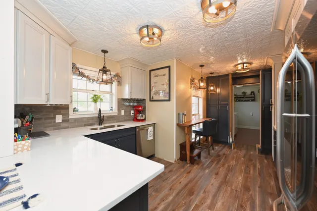 a bedroom with a bed and a table in it