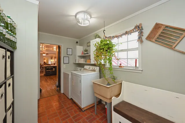 a view of a livingroom with workspace and a window