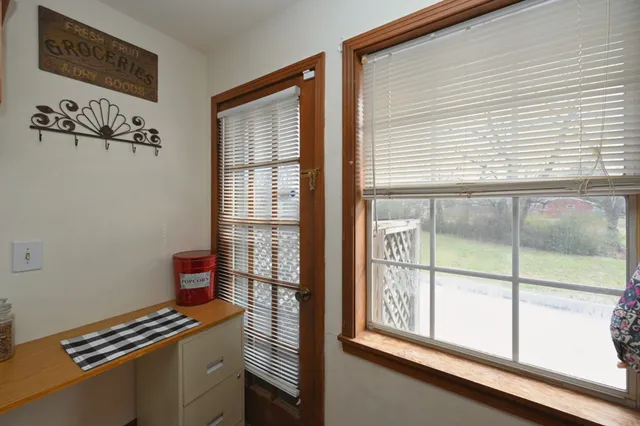 a kitchen with granite countertop a sink and cabinets
