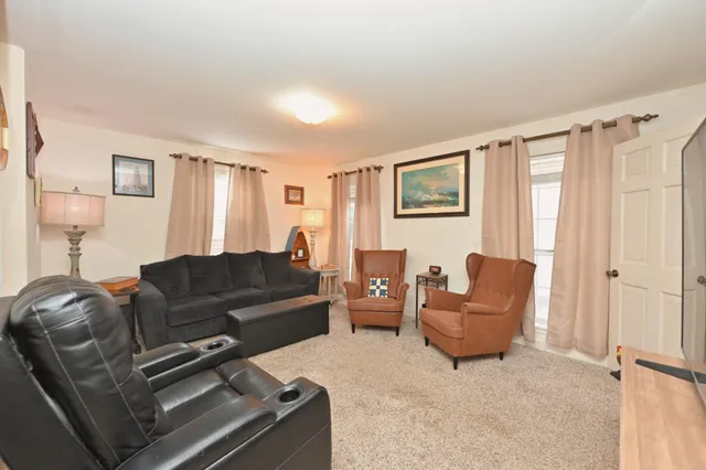 a room with a bed and wooden floor