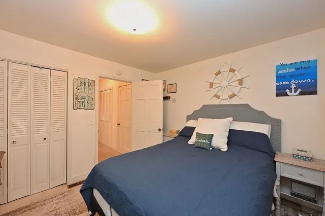 a living room with a bed furniture and a window